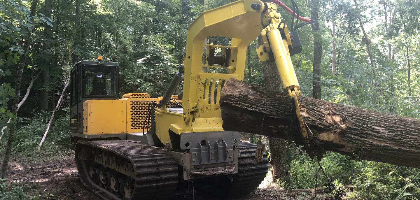 Terramac crawler carrier with grapple hook for forestry applications