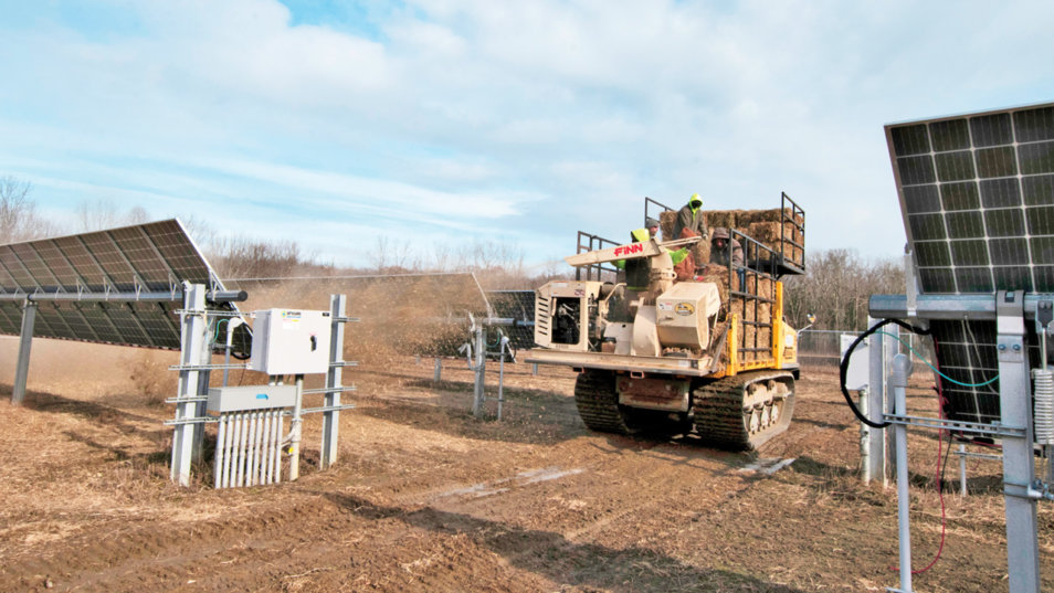 rear view of terramac laying straw on solar farm