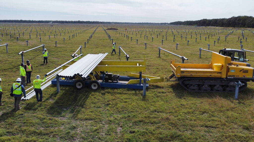 RT9 with Trailer for Installing Torque Tubes on Solar Farm